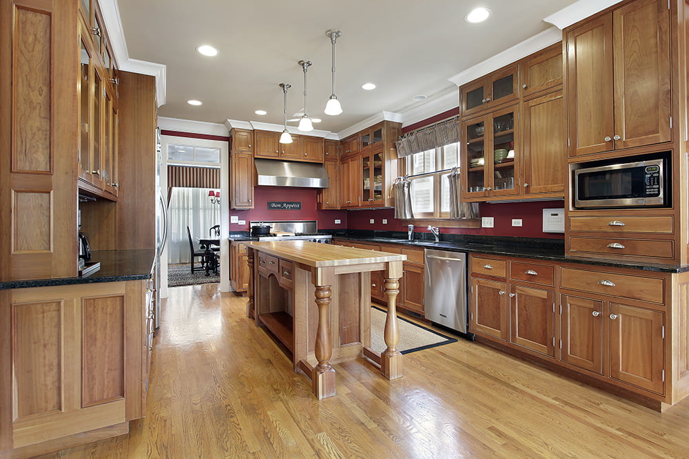 Kitchen in luxury home with wood center island